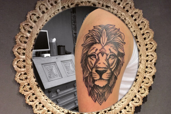 ♂ Lion on upper arm tattoo